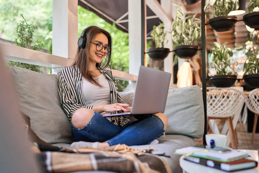 Beautiful girl working at home with laptop.