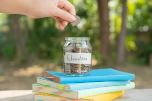 Putting money coins in a glass bottle for education