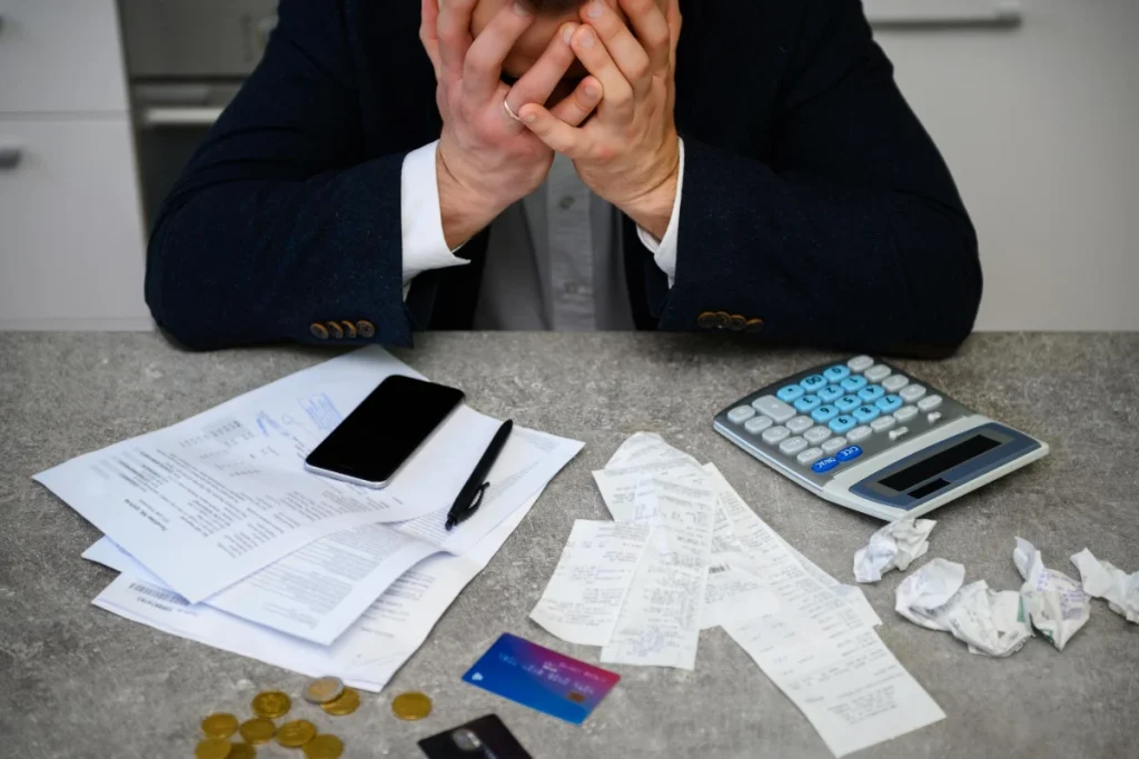 worried man calculating budget finances