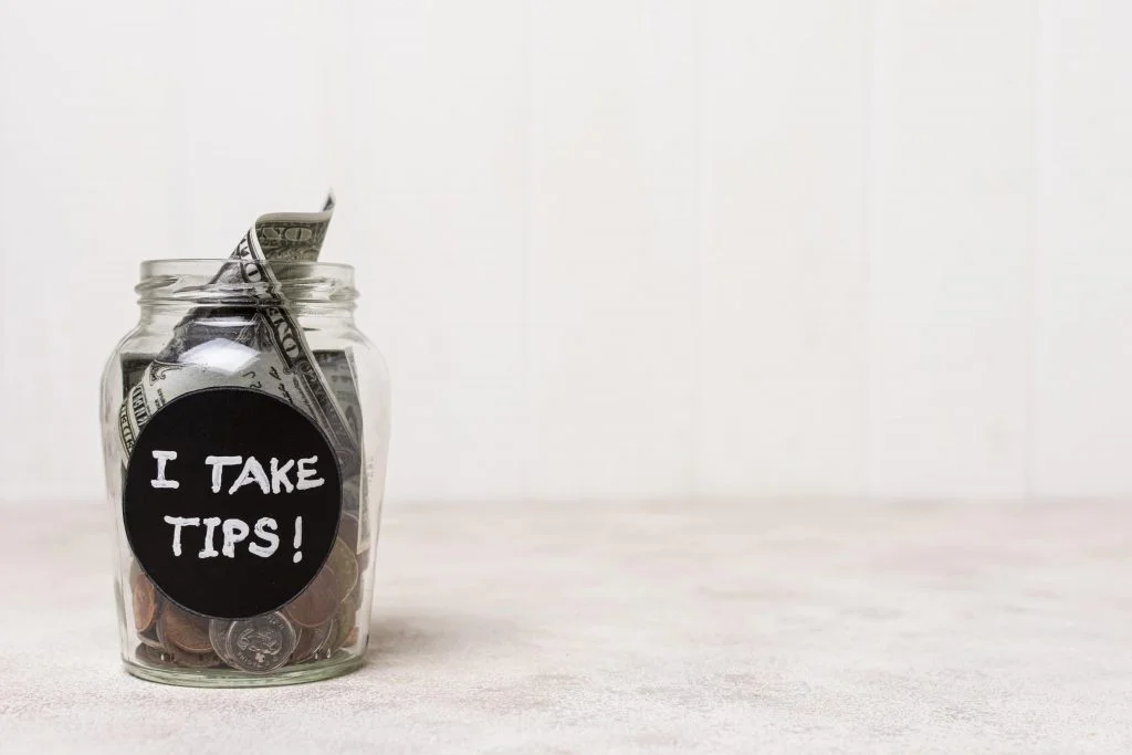 a jar full of tips for report tip tax in & near Bronx, NY